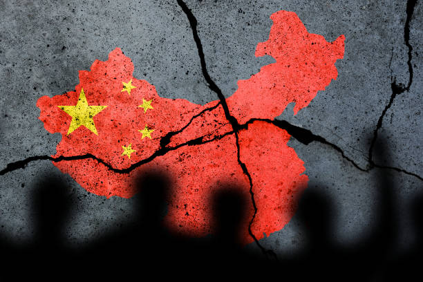 Flag of China painted on a cracked wall. Chinese real estate and debt crisis. Zero covid and lockdown protest in China stock photo