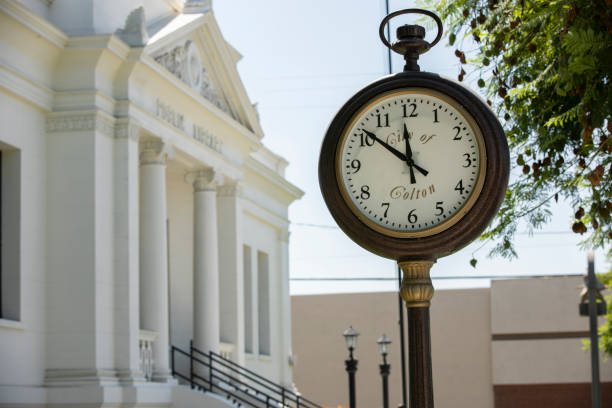 Colton, California, USA - September 18, 2022: Morning light shines on the historic downtown clock tower.