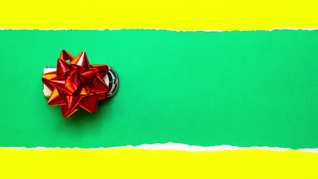 4k : Stop motion of the gift moving on green background, christmas present