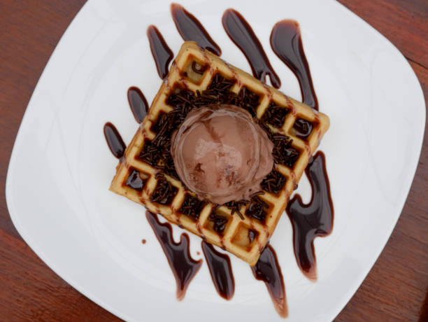 istock chocolate waffle with ice cream topping and chocolate sprinkles 1445088559