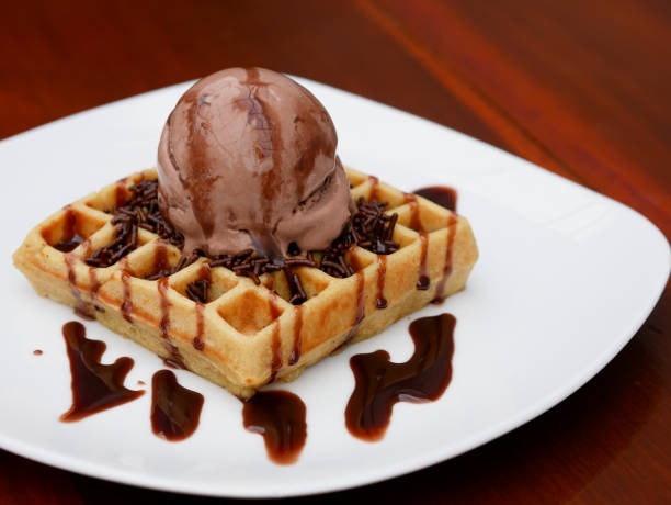 istock chocolate waffle with ice cream topping and chocolate sprinkles 1445088590