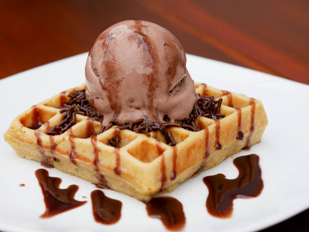 istock chocolate waffle with ice cream topping and chocolate sprinkles 1445088593