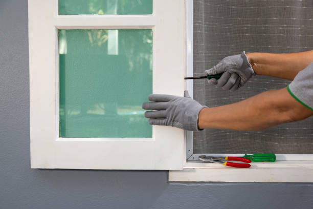 istock Construction worker repairing the wood window after storm. 1445089439