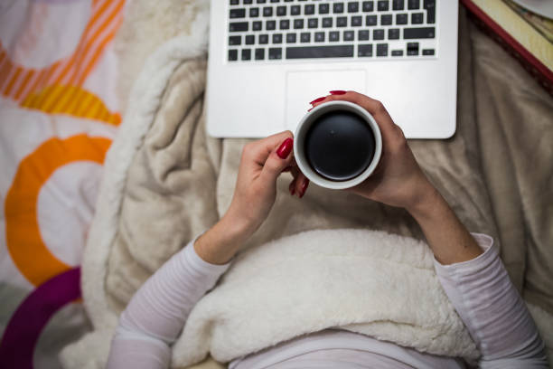 istock Woman surfing internet on laptop 1445090566