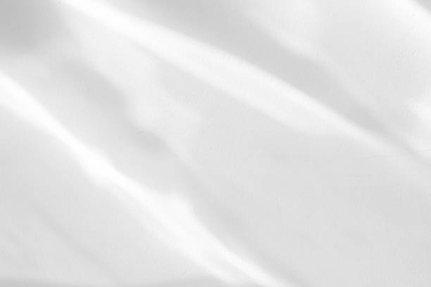 istock Reflected Light on White Concrete Wall Texture Background for Color Cast. 1445091542