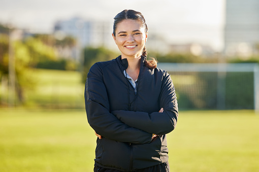 Soccer woman and coach portrait on field for match game in Mexico with optimistic and joyful smile. Proud, happy and excited Mexican football teacher smiling at professional sports tournament.