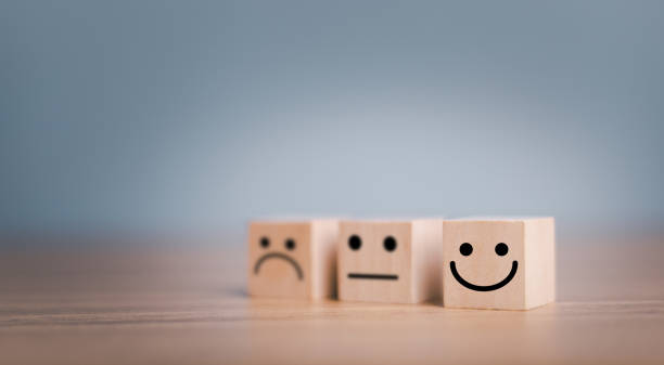 istock Customer service evaluation and satisfaction survey concepts, evaluation, Increase rating. Happy face smile face icon on wooden cube. 1445100052