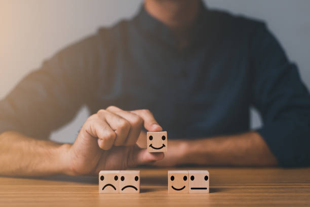 istock best excellent business services rating customer experience. Satisfaction survey concept. Hand of a businessman chooses a smiley face on wood block cube. 5 Star Satisfaction. 1445100876