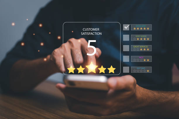 istock Customer service satisfaction survey concept.Business people or customers show satisfaction through the application on the tablet screen. By giving the most satisfaction rating and 5 stars. 1445100961