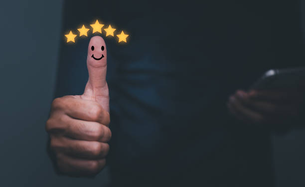 istock Customer Experience Concept,Best Excellent Services Rating for Satisfaction present by Thumb of Client with gold stars and Smiley Face icon. 1445101886