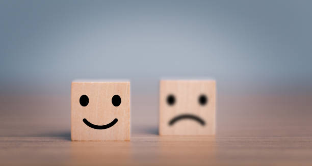 istock Customer service evaluation and satisfaction survey concepts, evaluation, Increase rating. Happy face smile face icon on wooden cube. 1445102097
