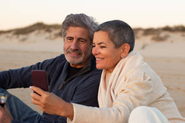 istock Senior couple spending time at the beach at sunset 1445102992