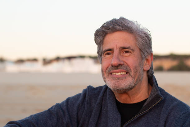 istock Portrait of grey-haired bearded senior man spending time outside 1445103245