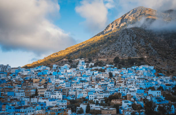 Chefchaouen townscape with mountain background in the morning Chefchaouen townscape with mountain background in the morning chefchaouen photos stock pictures, royalty-free photos & images