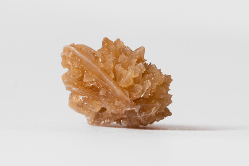 A kidney stone on a white background.