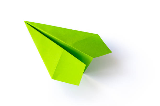 istock Green paper plane origami isolated on a white background 1445107525