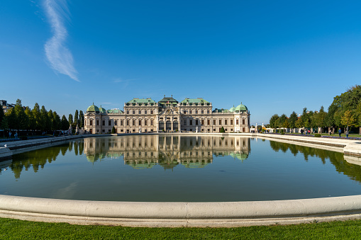 Vienna, Austria - 22 September, 2022: view of the Upper Belvedere Palace in downtown Vienna with reflections in the fountain pool