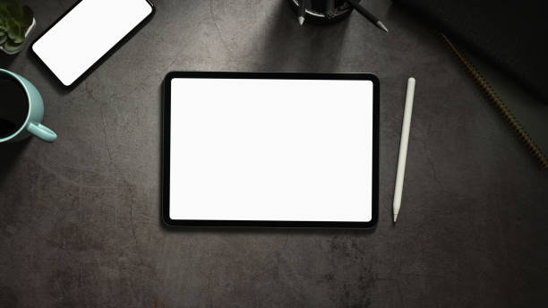 Top view minimal workspace with office supplies and digital tablet ,smartphone on cement surface table. Top view minimal workspace with office supplies and digital tablet ,smartphone on cement surface table. computer mouse on table stock pictures, royalty-free photos & images