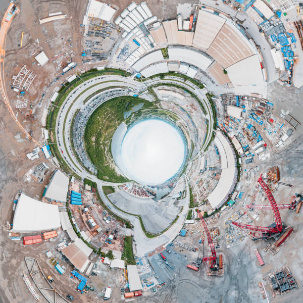 istock 360 Wide Panoramic image of New Construction site with cranes and construction machinery. Container ship loading and unloading, Cargo container in deep seaport for the international order concept. 1445118252