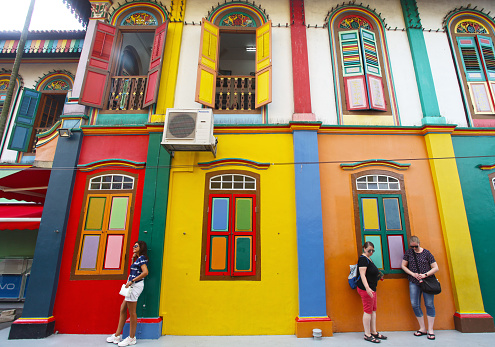 Tourists at the Tan Teng Niah house Little India Singapore. Built in 1900 this is the only ancient Chinese building left in Little India and now a tourist attraction as it is colourfully painted