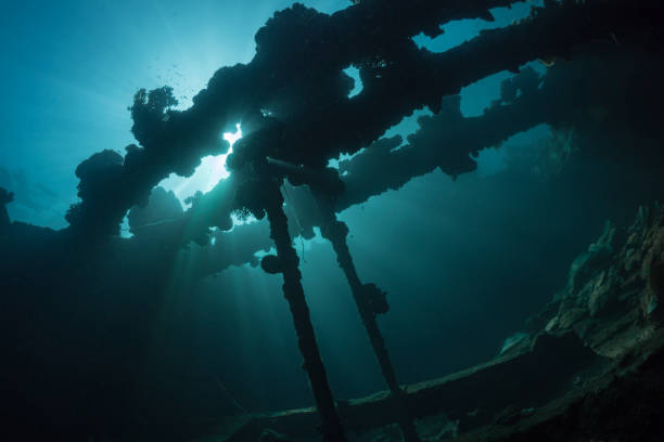 istock Sunrays burst through the water above wreck in the Ocean 1445121560