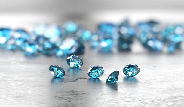 group of blue diamond sapphire placed on glossy background main object focus 3d rendering - sapphire gem topaz blue imagens e fotografias de stock