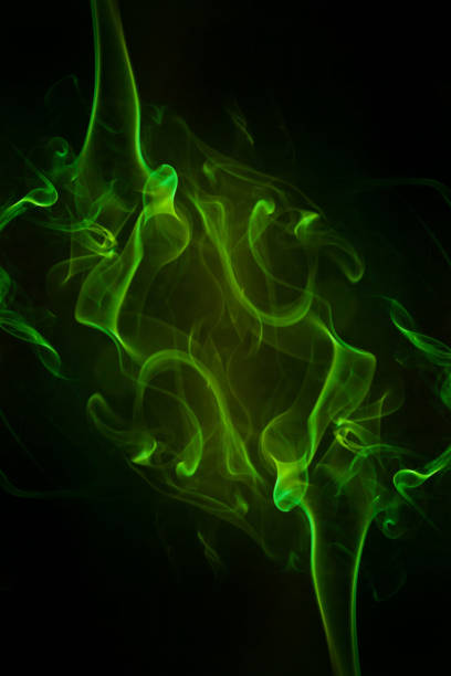 istock Green smoke motion on black background. 1445123690