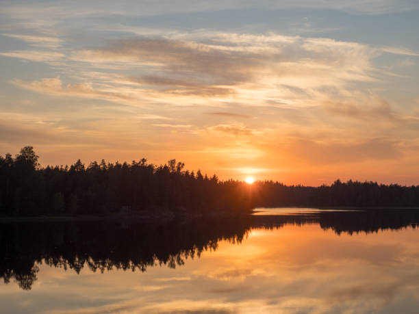 istock dramatic sunset over a forest lake in summer 1445123887