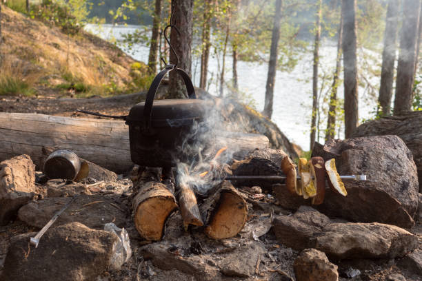 istock pot over the fire and drying mushrooms 1445123919