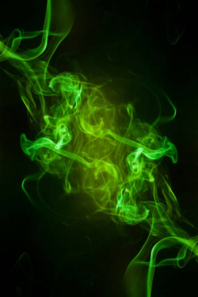 istock Green smoke motion on black background. 1445124732