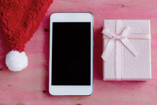 istock smartphone with christmas decorations in background 1445126681