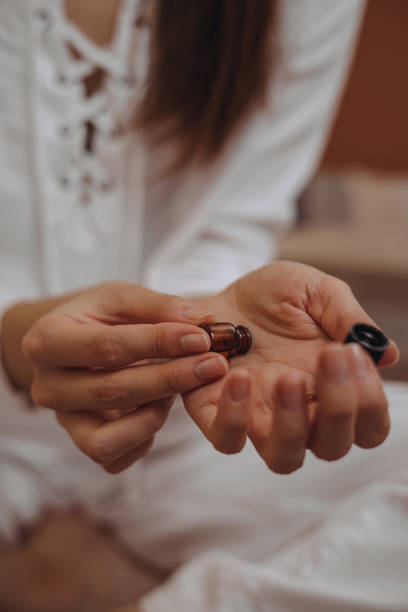 istock Female applying natural aromatherapy oil on hands 1445126973