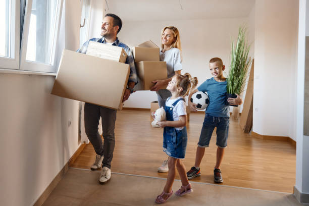 istock Happy family moving into a new home. 1445127052