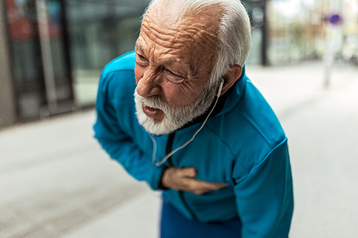 Senior man jogging in city