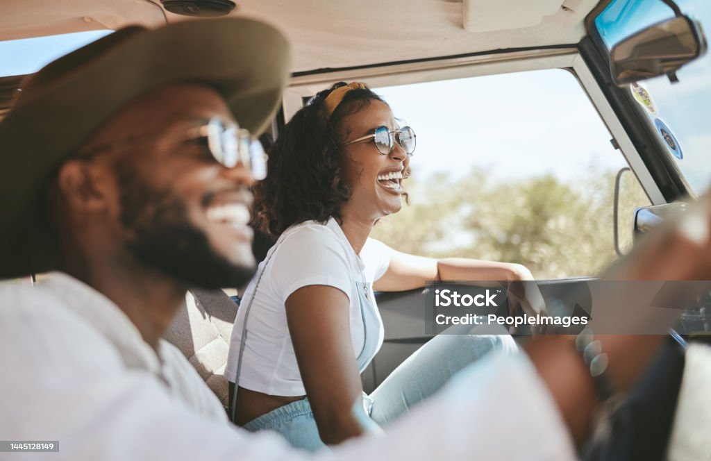 Travel, road trip and black people couple driving by countryside for holiday, journey and freedom with happiness. Trendy sunglasses, fashion and gen z friends in a car drive for vacation lifestyle Road Trip Stock Photo