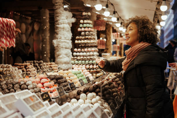 istock Woman buying Christmas candy. 1445128307