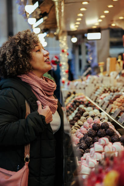 istock Joyful tourist at Christmas fair. 1445128455