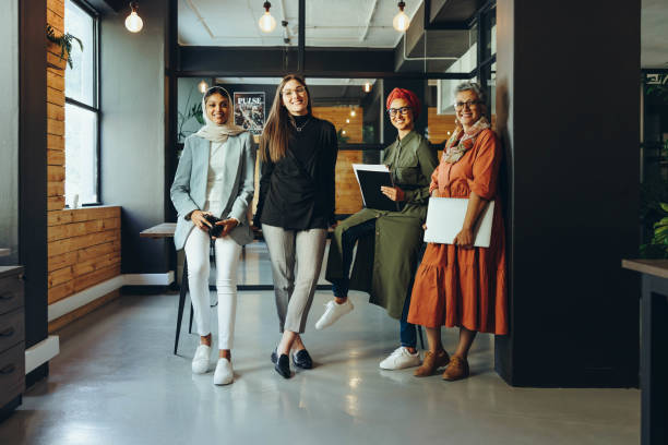 istock Successful female designers smiling at the camera in an office 1445128637