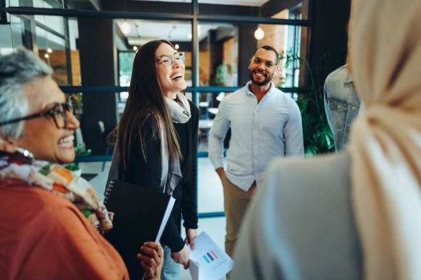 istock Happy businesspeople laughing cheerfully during a meeting 1445128722
