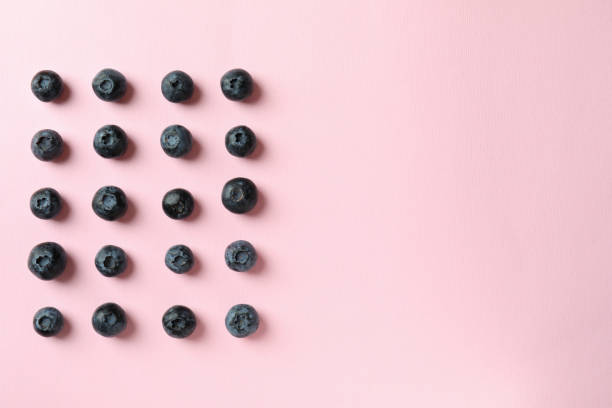 istock Fresh berry concept with blueberry on pink background 1445129880