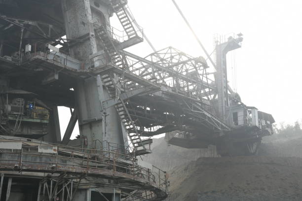 istock Bucket-wheel excavator during excavation at the surface mine. Huge excavator on open pit mine. 1445129991