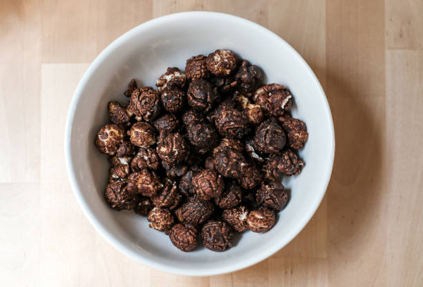 istock chocolate popcorn in a white bowl top view 1445130944