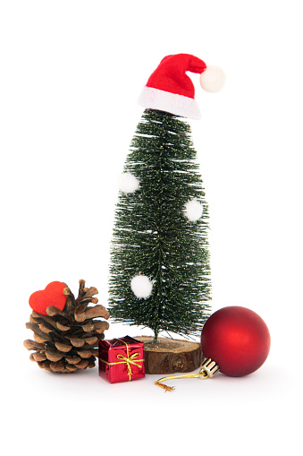 Artificial Christmas tree decorated with Christmas balls on an isolated white background