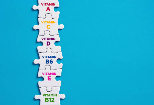 Vitamin supplement concept for the human body immune system. Need for vitamins and minerals. Vitamin supplement concept for the human body immune system. Need for vitamins and minerals. Vitamin icons connected on jigsaw puzzle. vitamin a nutrient stock pictures, royalty-free photos & images