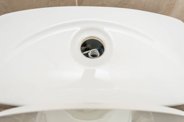 istock Toilet bowl lid without flush button. Broken toilet flush valve. 1445133969