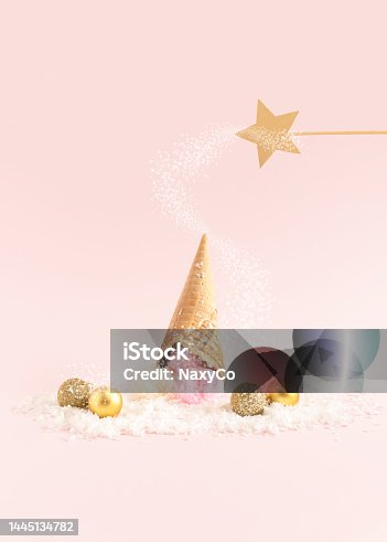 istock Magic wand casting a spell on an ice-cream lying upside down on a snow. Winter creative idea. 1445134782