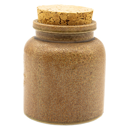 a single brown clay cup or bottle with cork, cutout