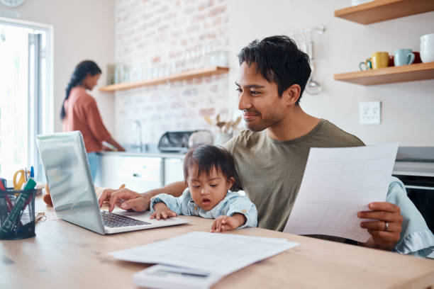 Man, baby or laptop finance in house or home kitchen and insurance paper, investment documents or fintech accounting software. Happy smile, asian father and down syndrome boy, son and child with tech finanzas para hombres, bebés o computadoras portátiles en la cocina de la casa o en el hogar y papel de seguro, documentos de inversión o software de contabilidad fintech. sonrisa feliz, padre asiático y niño, hijo y niño con síndrome de down con te