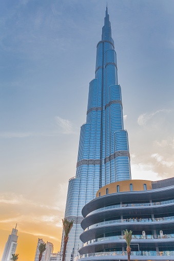 Modern skyscrapers of Dubai city, UAE with burj khalifa, cityscape background. Amazing urban landscape of new city towers at blue sky. Construction and modern architecture concept. Copy ad text space