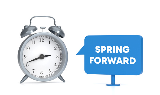 Spring Forward written blue speech bubble and alarm clock. Time Concept.